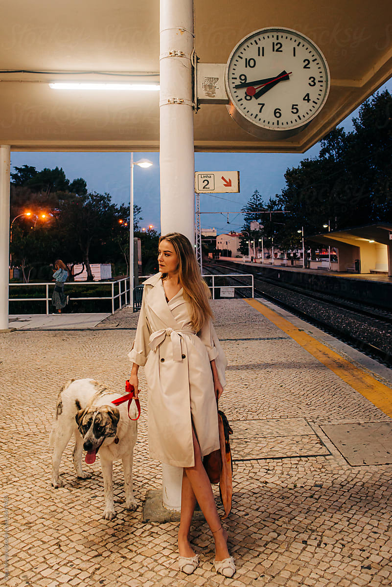 Woman and her dog at the train station