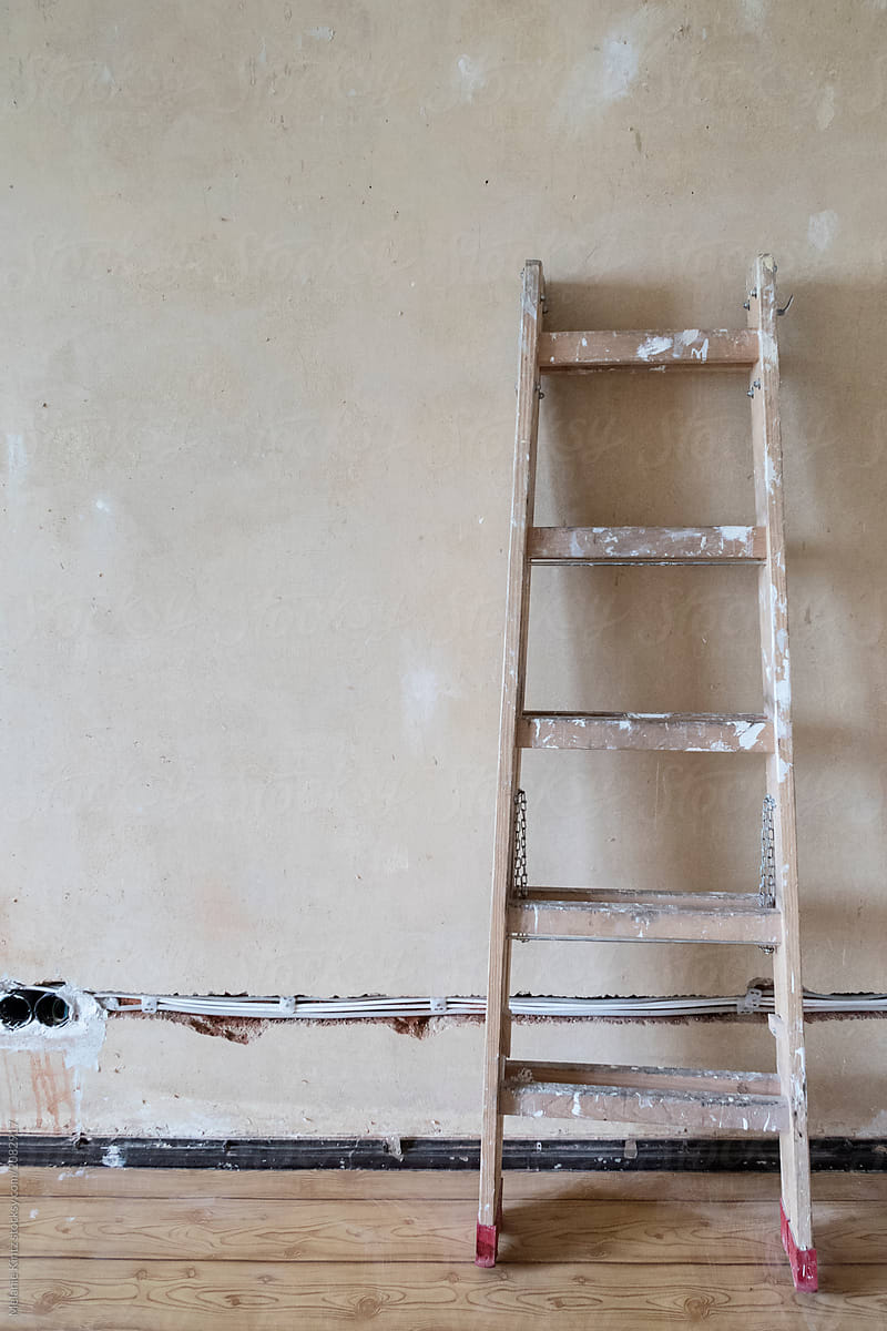 Ladder in front of wall with newly drawn wiring