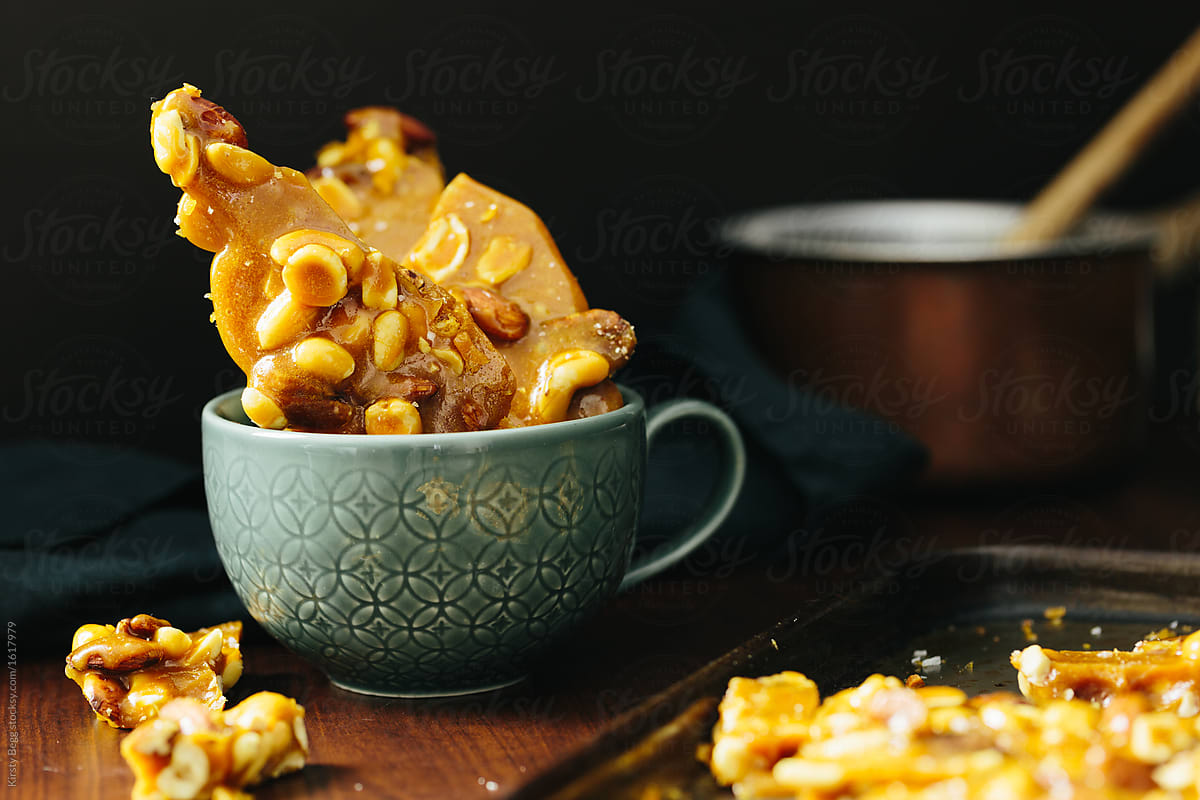 Horizontal of salted caramel nut brittle in cup
