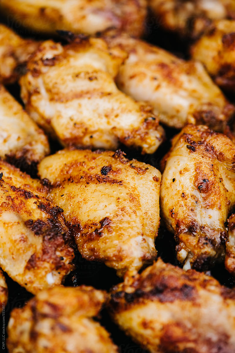 Closeup of chicken wings on the grill