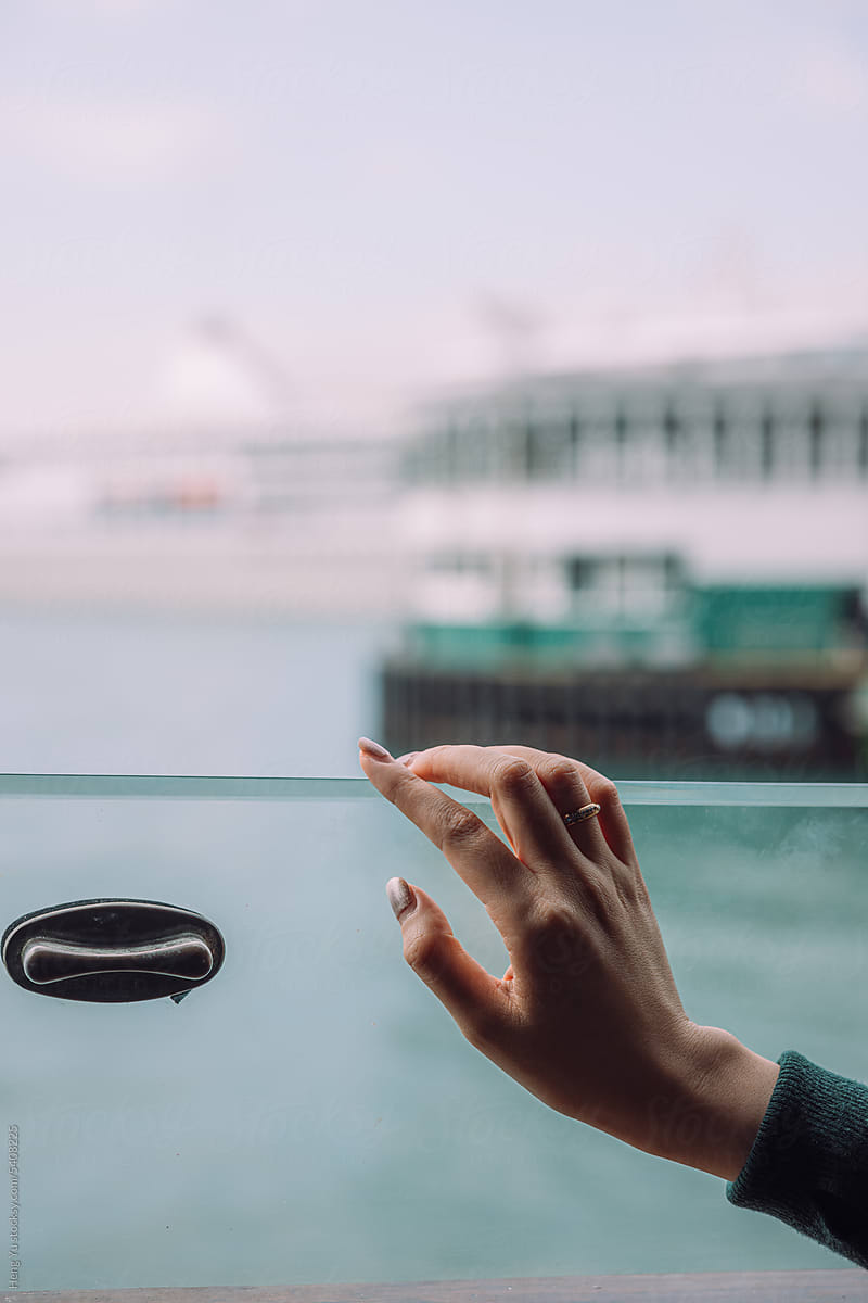 Hand on ship window