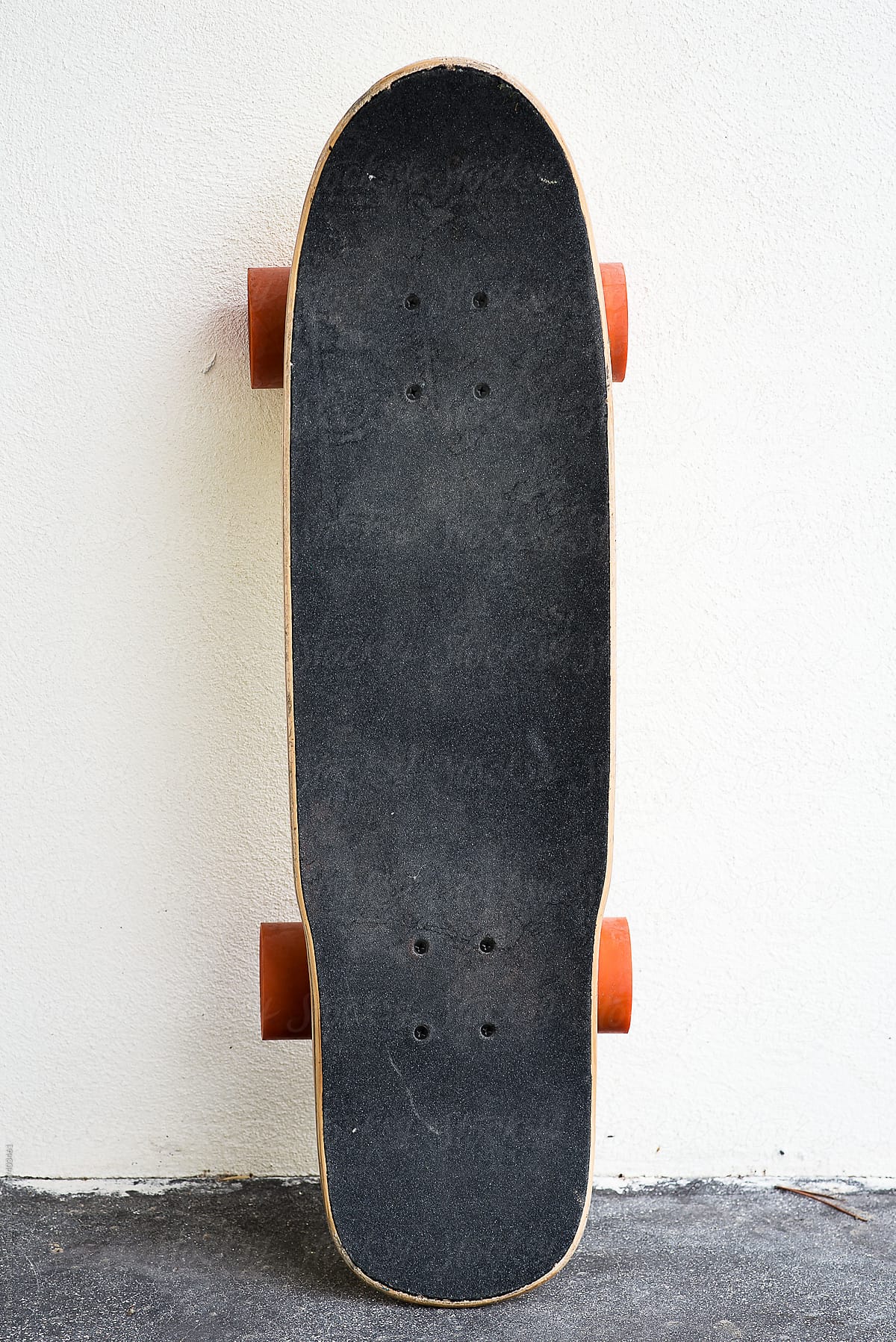 Skate board on a white wall