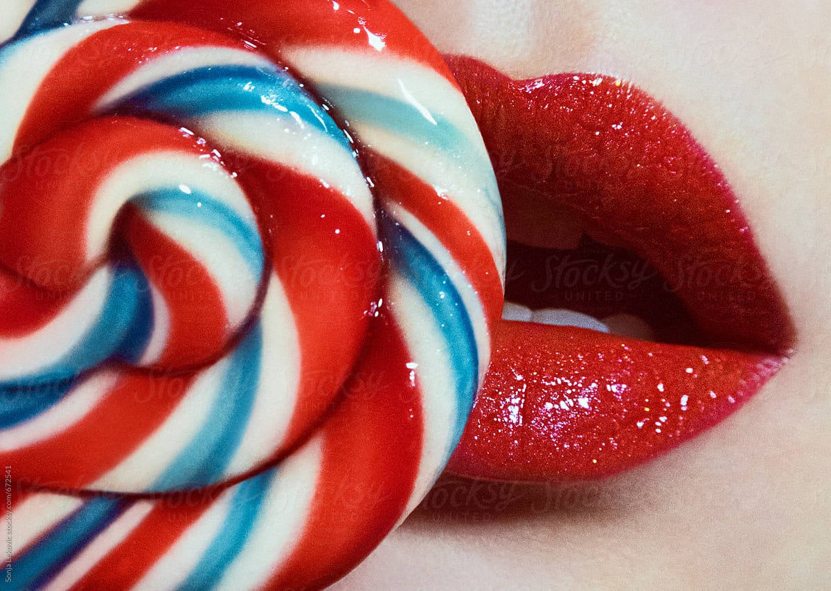 red shiny lips and spiral candy closeup