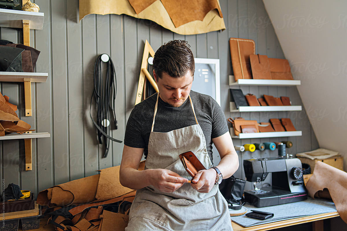 The master works in his leather workshop