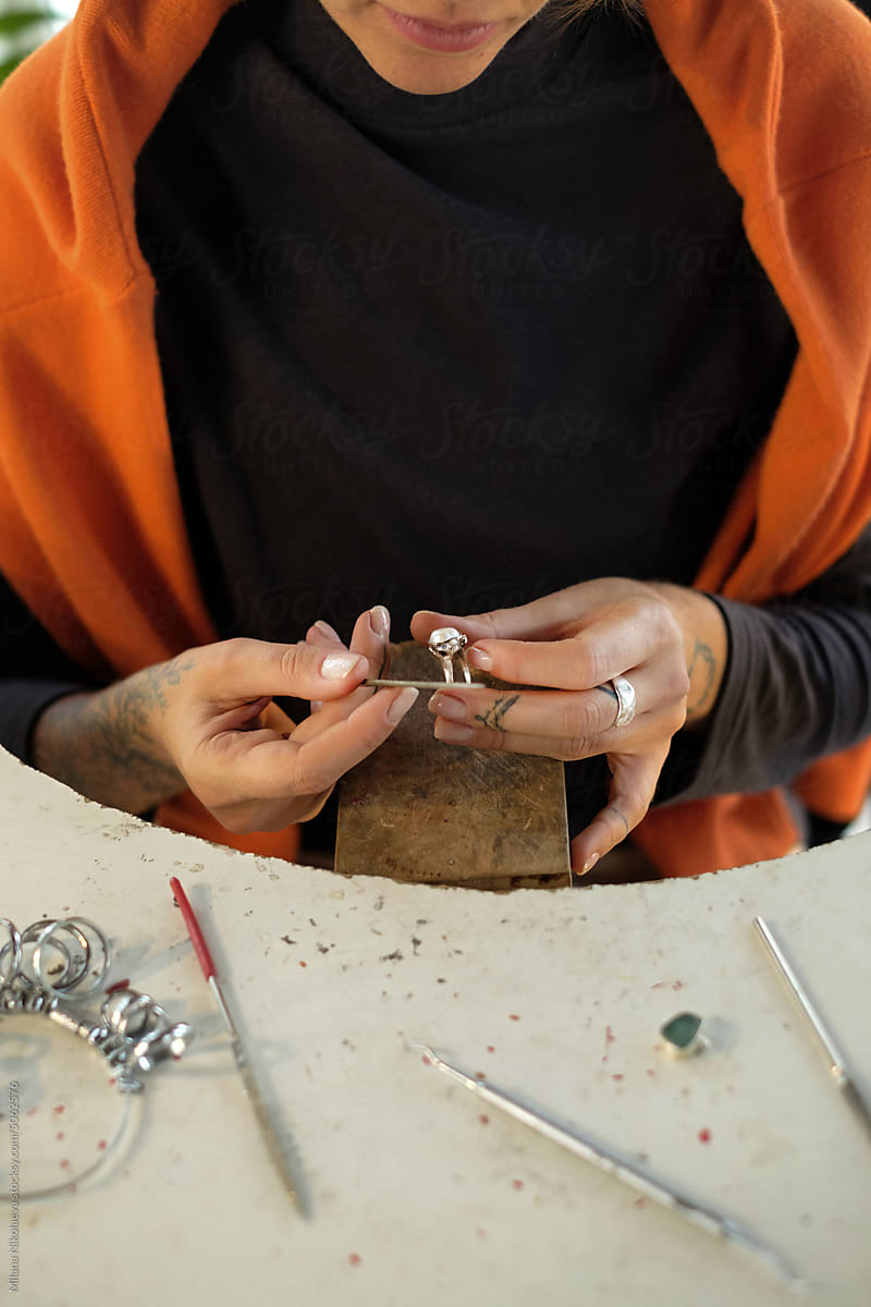 Jeweller making jewellery in her studio