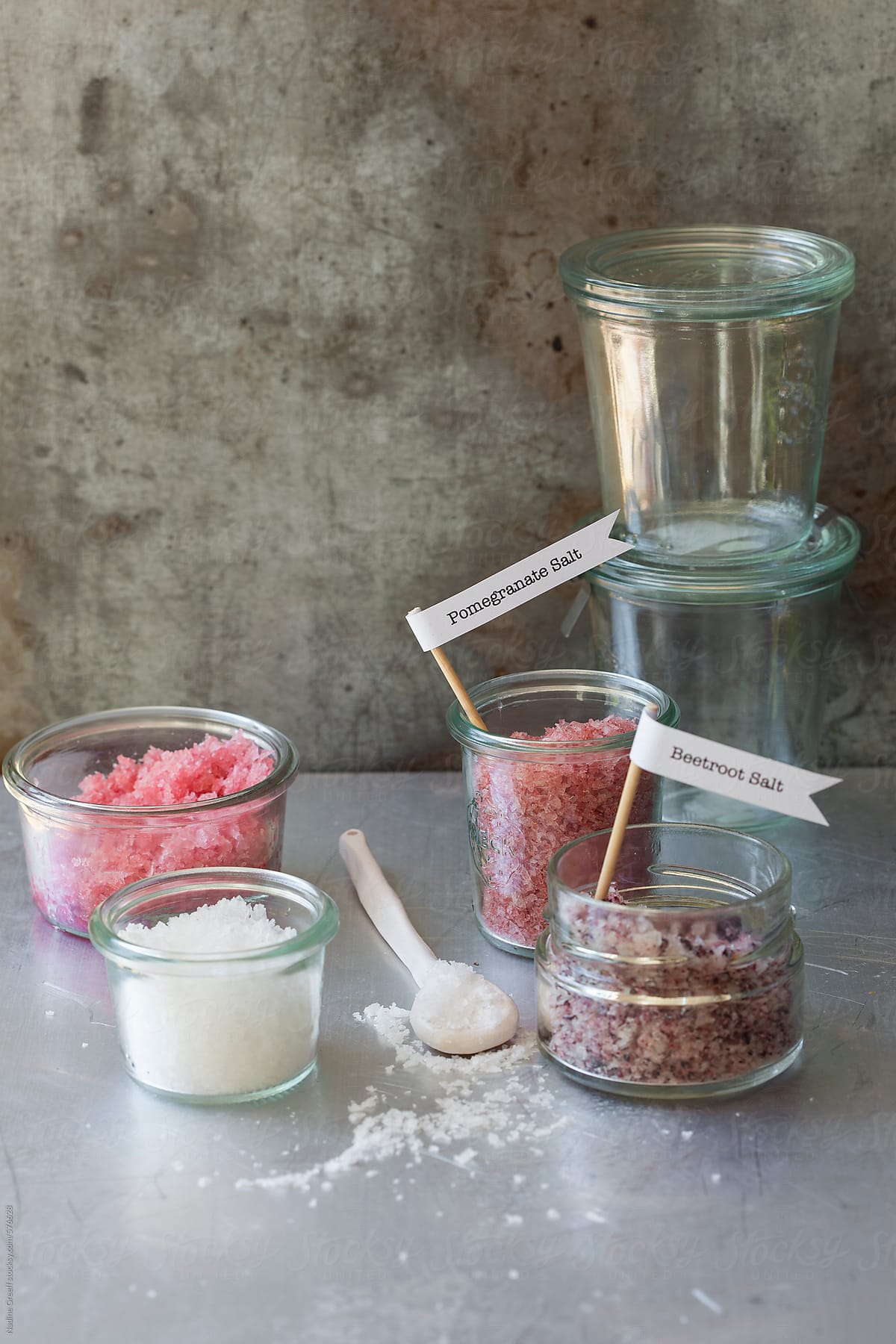 Salt: Beetroot salt, pomegranate salt and white salt in glass pots