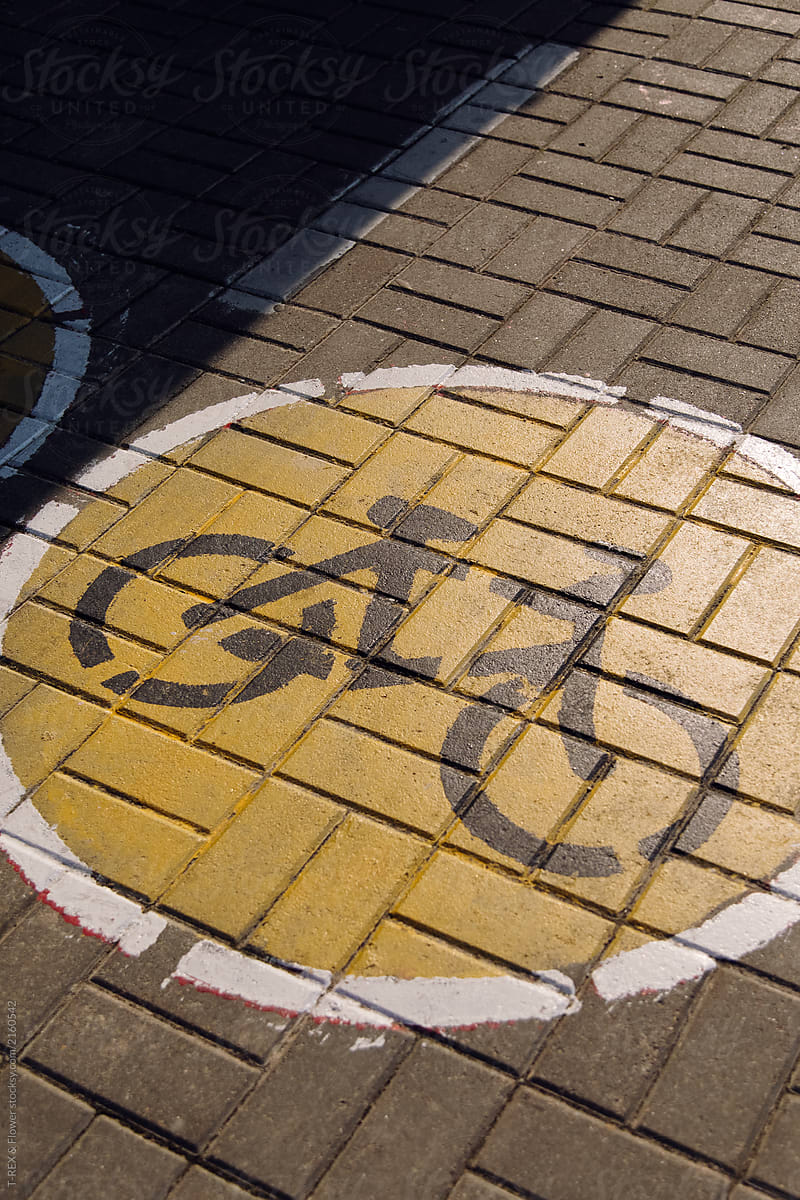 Bicycle path sign on pavement