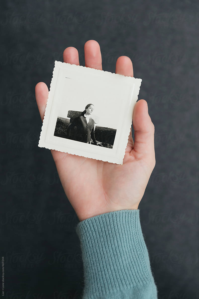 Closeup of hand holding vintage photograph