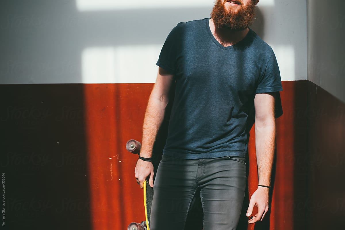 Young Alternative Skater With Red Beard
