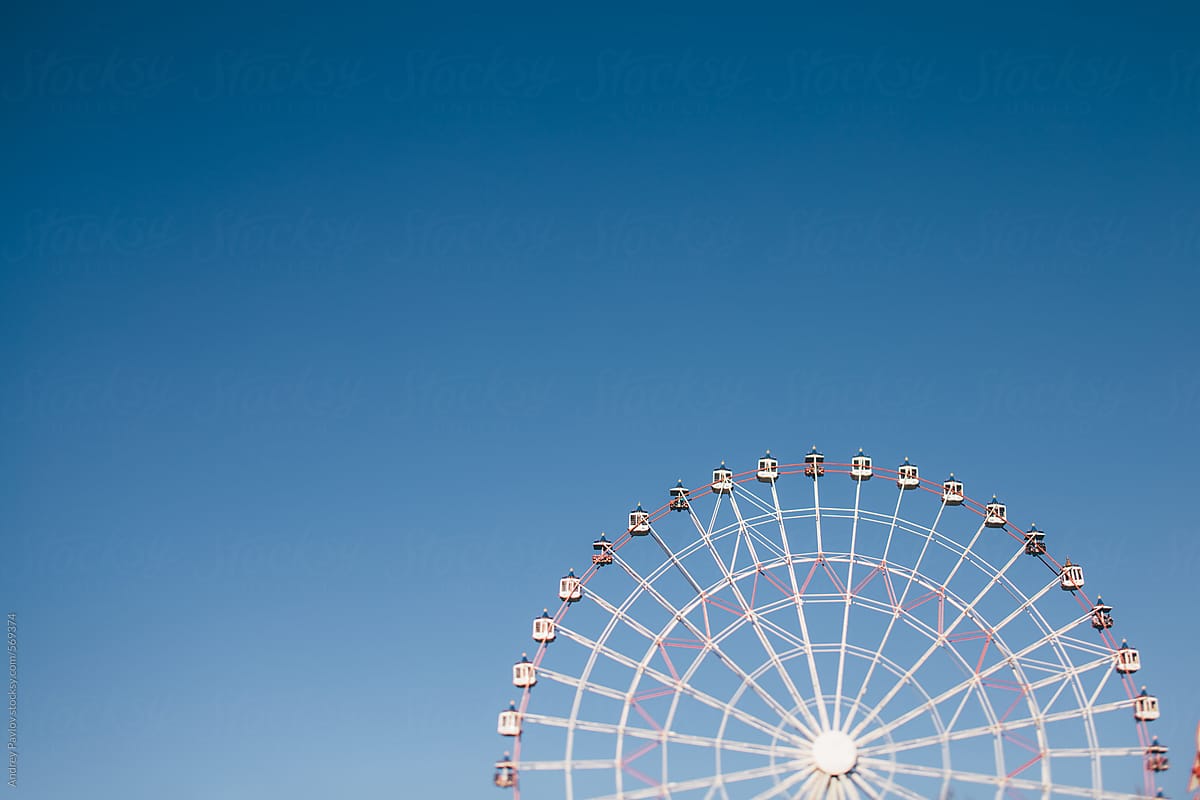 Ferris wheel on blue background