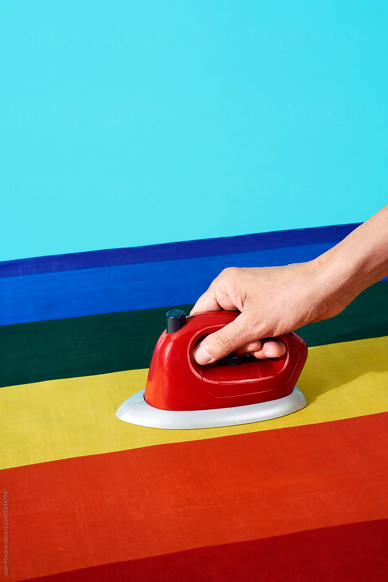 ironing a rainbow pride flag