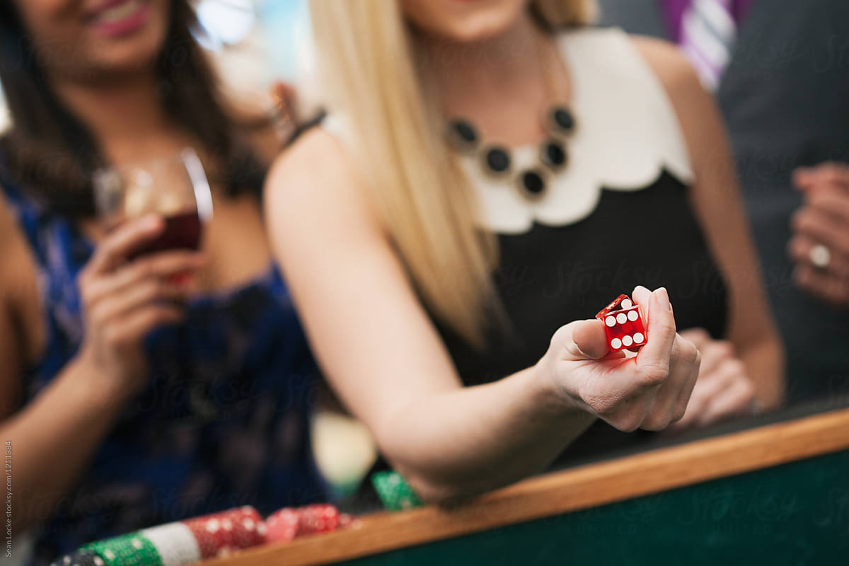 Casino: Woman Ready To Roll Dice In Game Of Craps