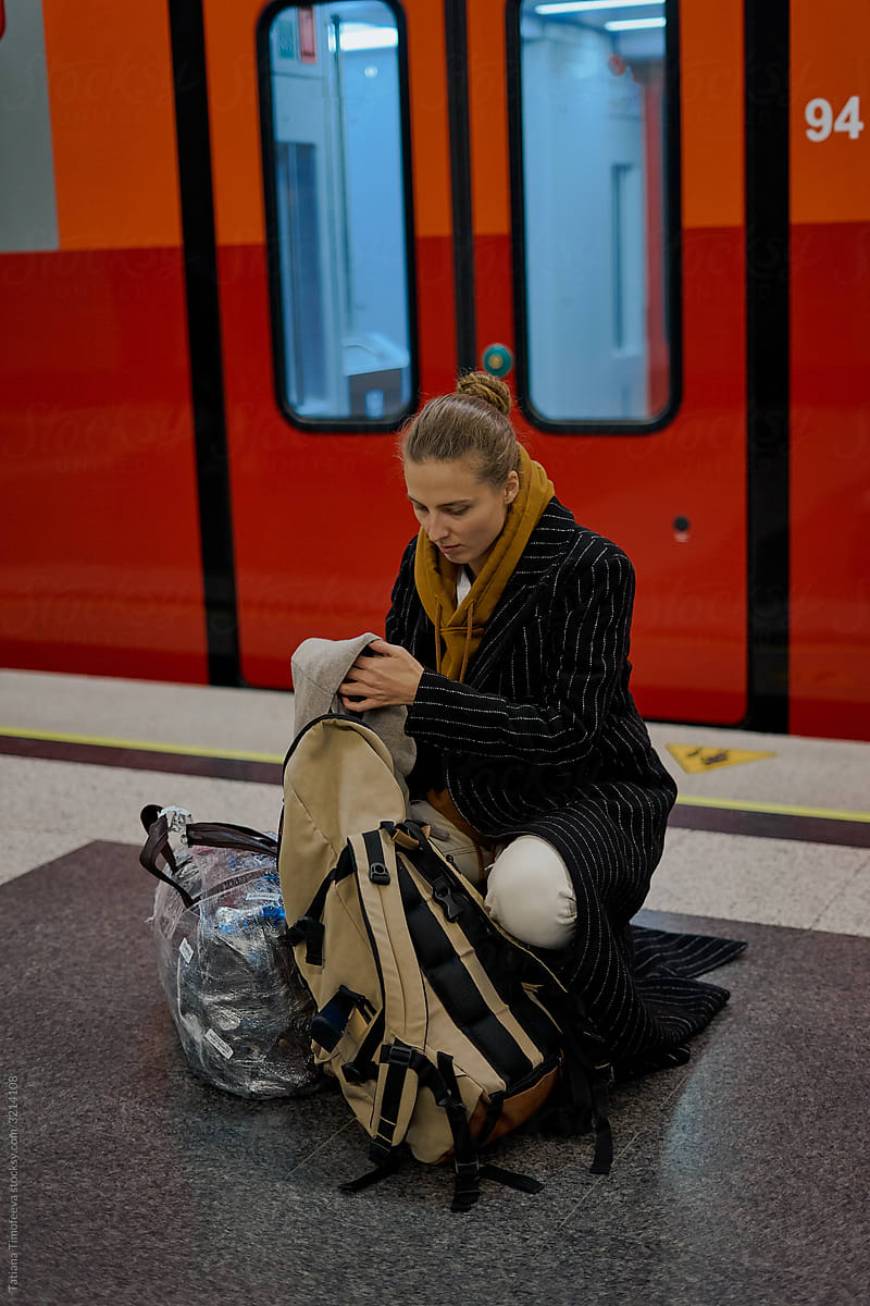 woman using smartphone in train to airport