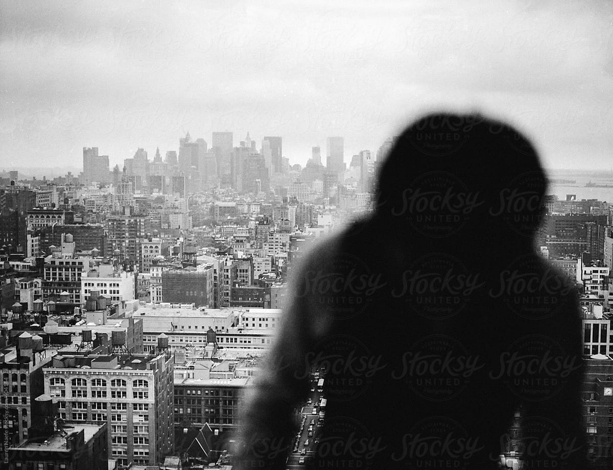 Silhouette moving in front of NYC skyline