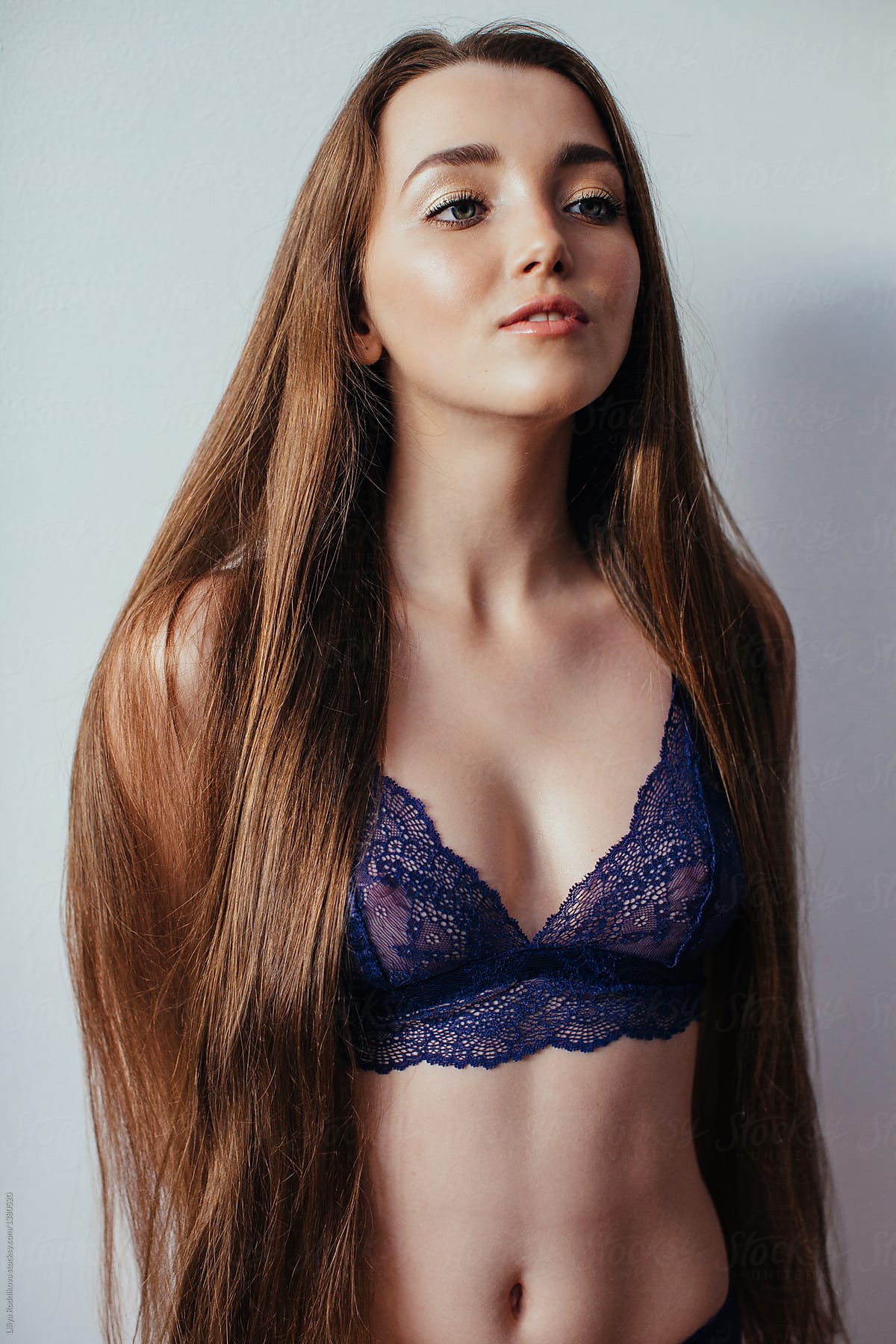 Portrait Of Young Beautiful Smiling Female With Long Hair In White Lace Bra  by Stocksy Contributor Liliya Rodnikova - Stocksy