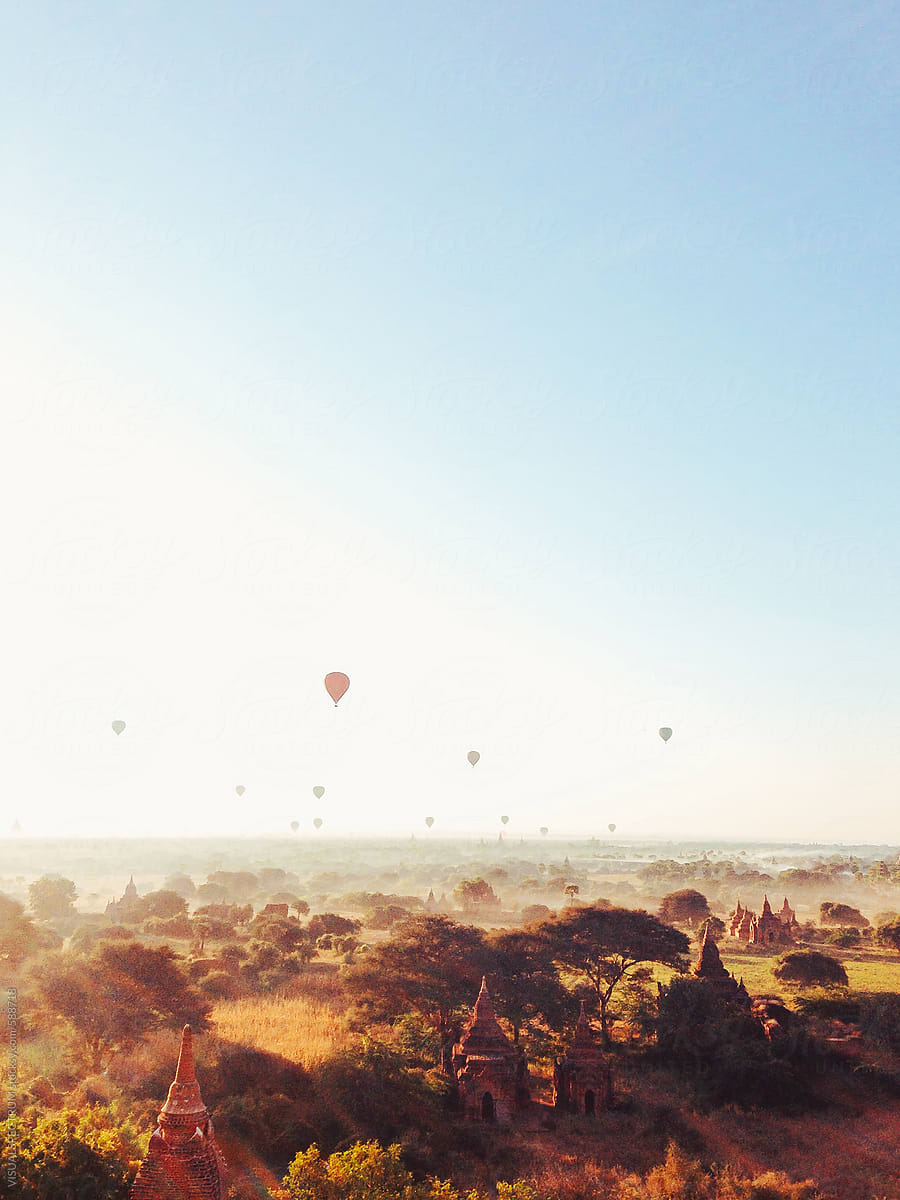 Hot-Air Balloons Flying Over Bagan Pagodas in Warm Morning Light