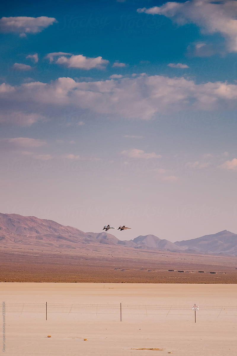 Two Jets  Against Desert Sky
