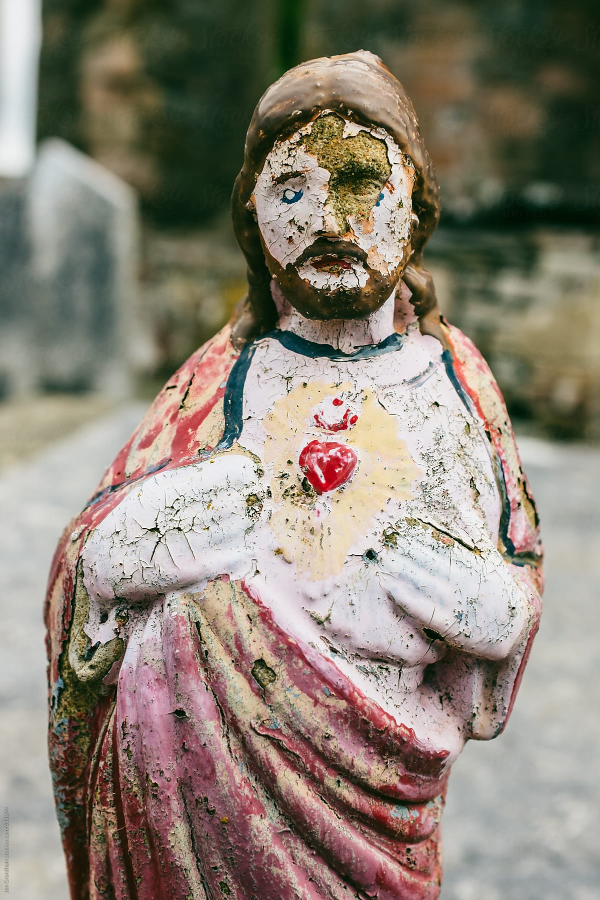 Jesus figurine in an old cemetery