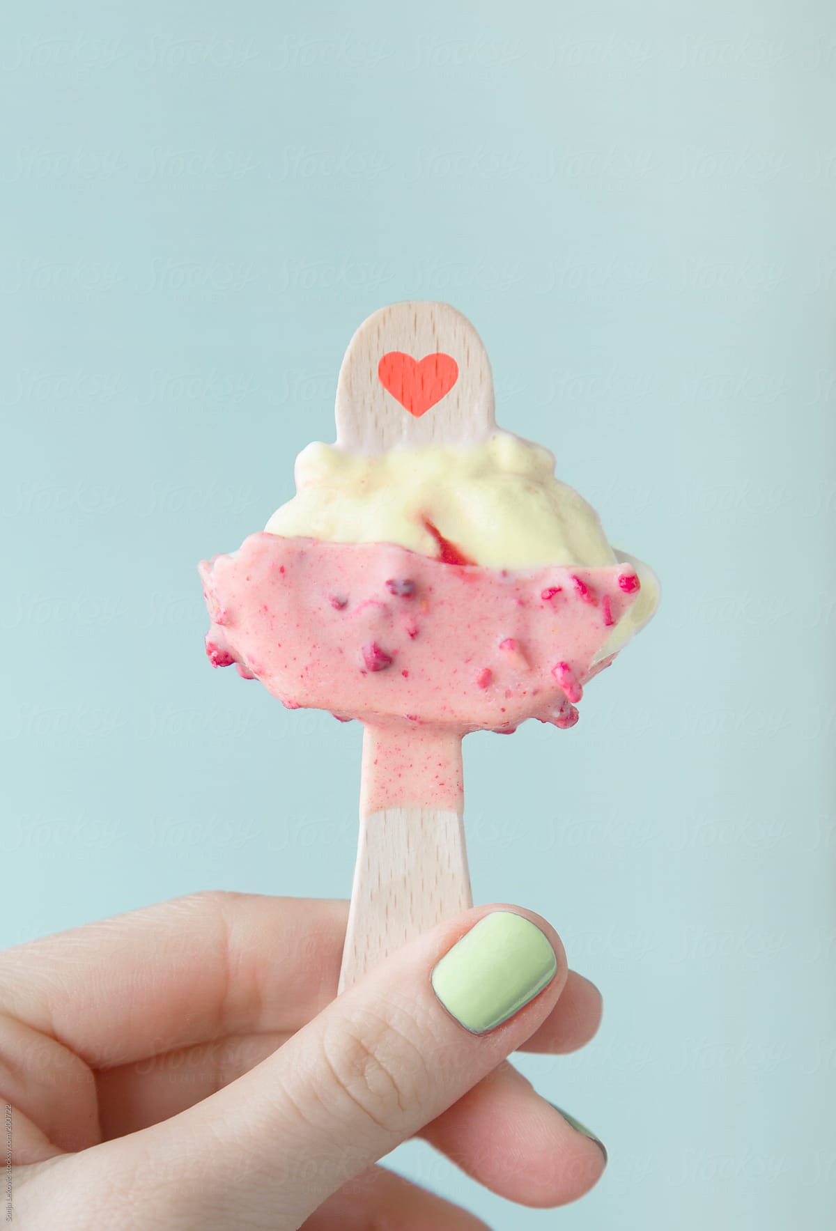 pastel half-eaten ice cream in hand