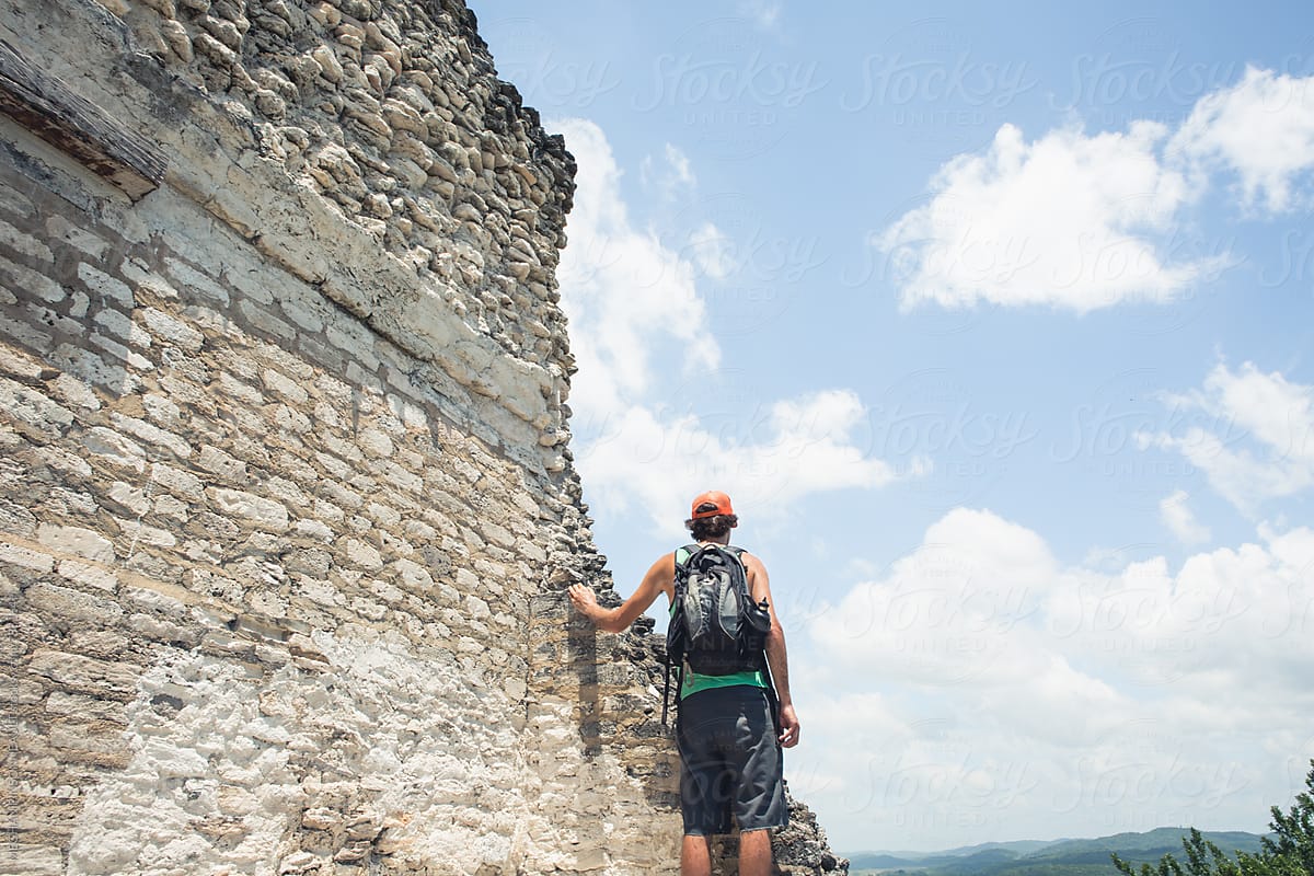 Man on Top of Ancient Mayan Temple