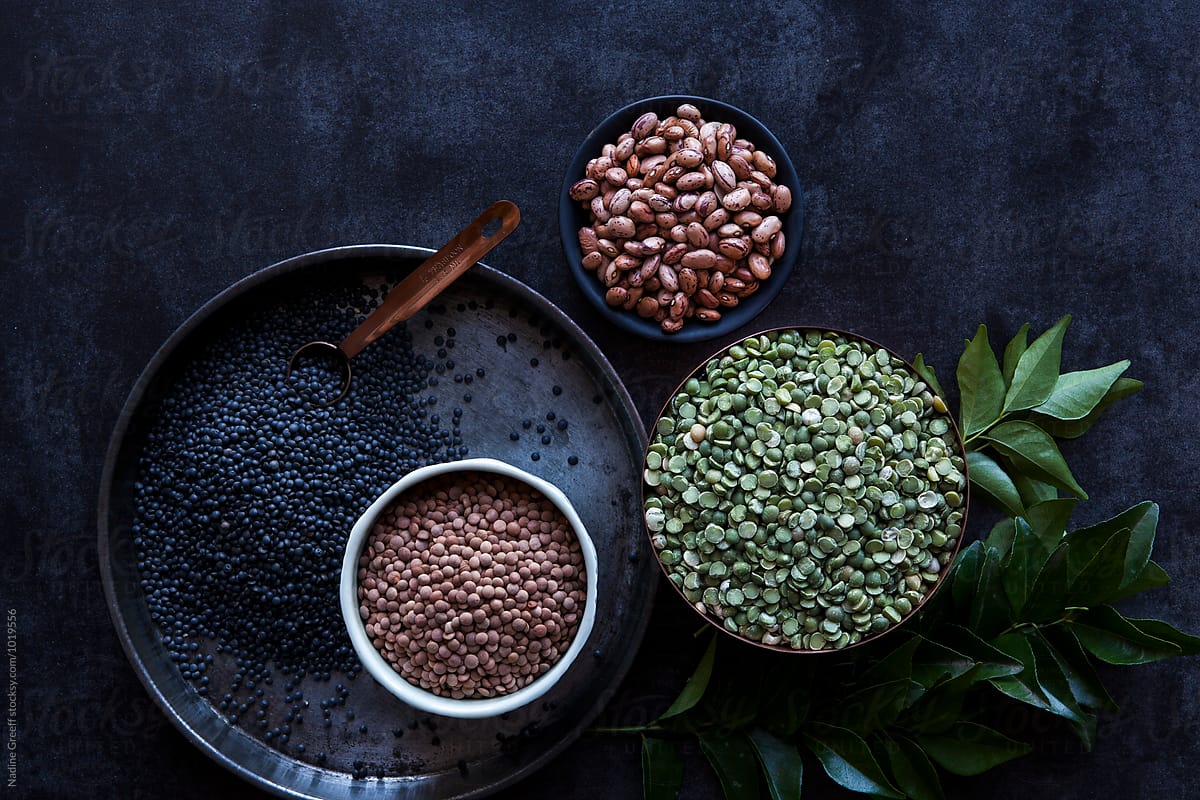 A variety of dried beans, pulses, lentils and curry leaves