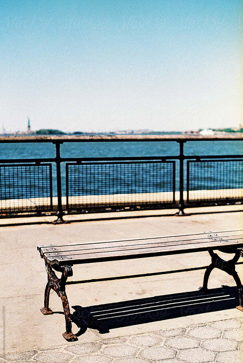 lonley bench by the water in New York, 35 mm
