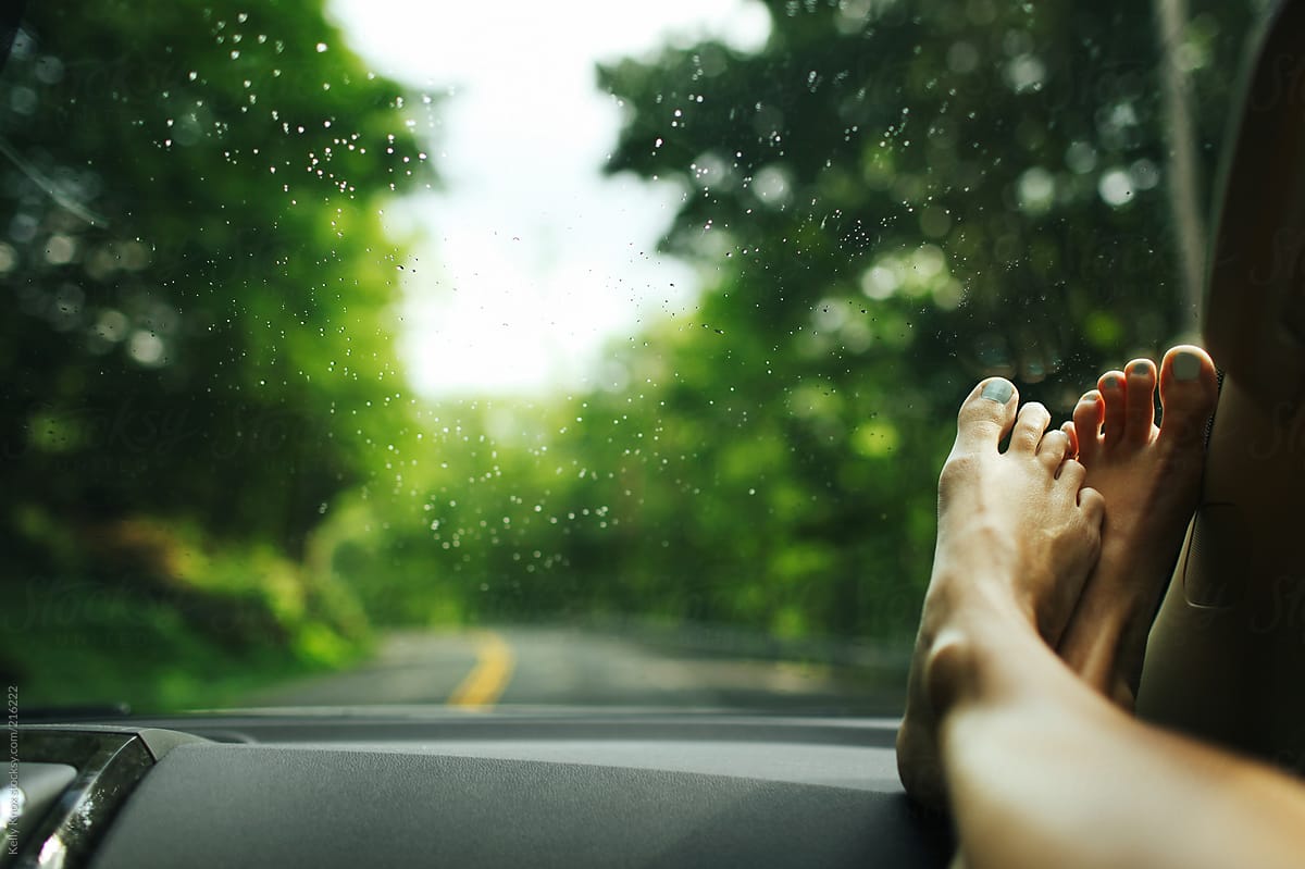Woman S Feet On The Dashboard Of A Car During A Road Trip By Stocksy