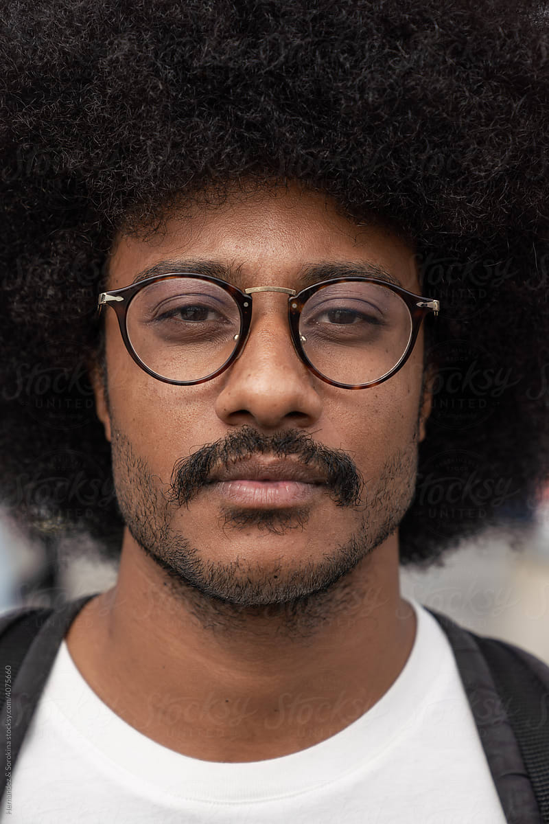 Portrait Of Hipster With Afro Hair Outdoors
