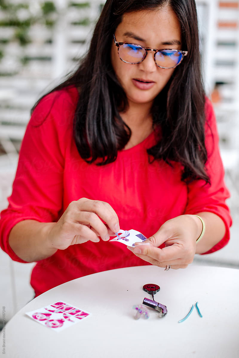 Woman putting stickers on cochlear implant
