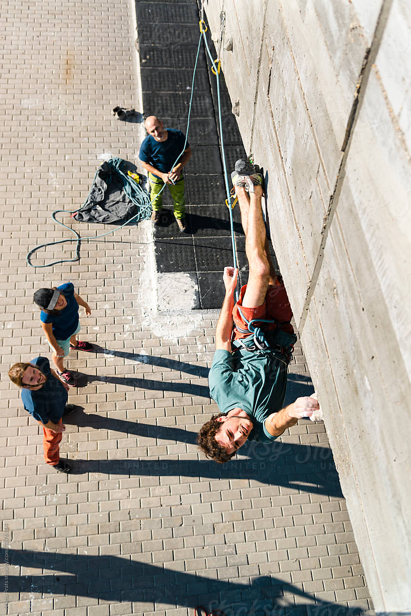 Sportsman working out in climbing wall