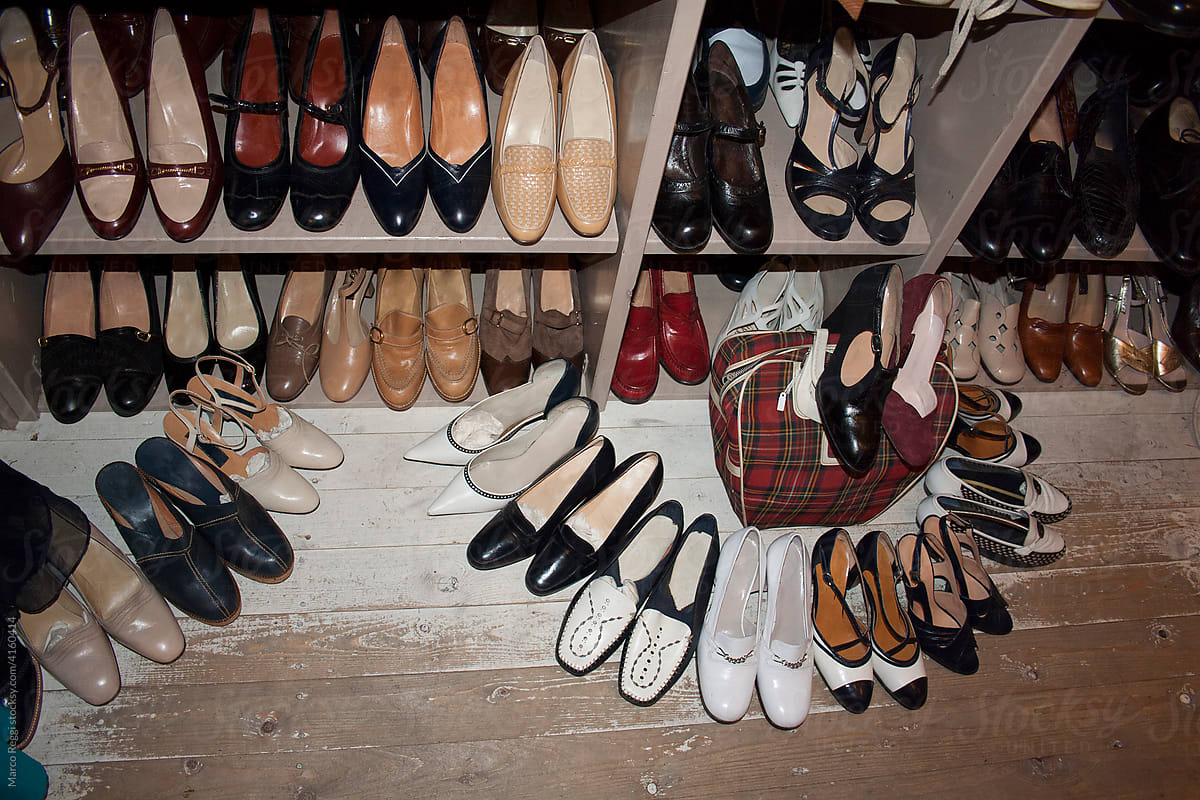 many women\'s vintage shoes in a thrift shop,
