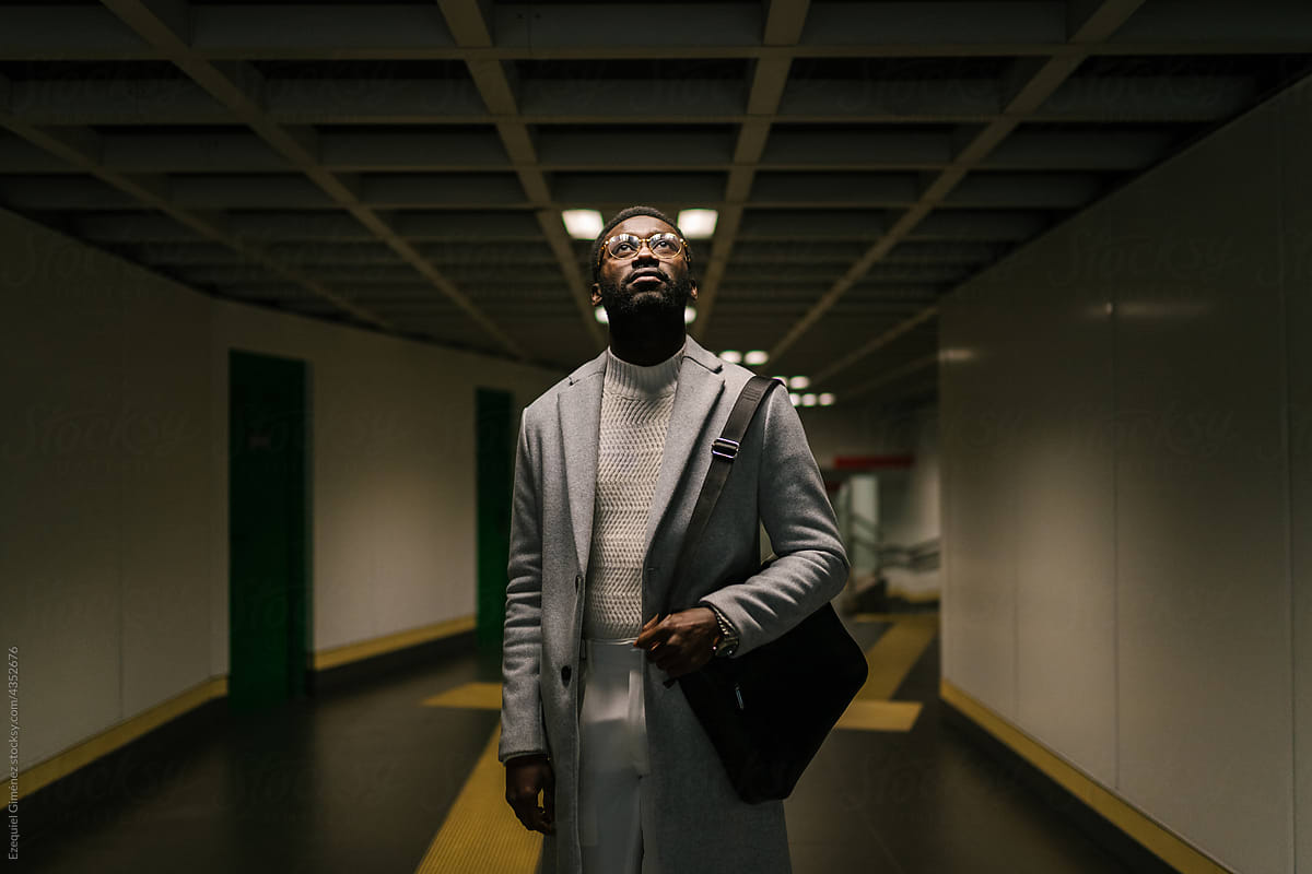 Elegant black man in underground corridor