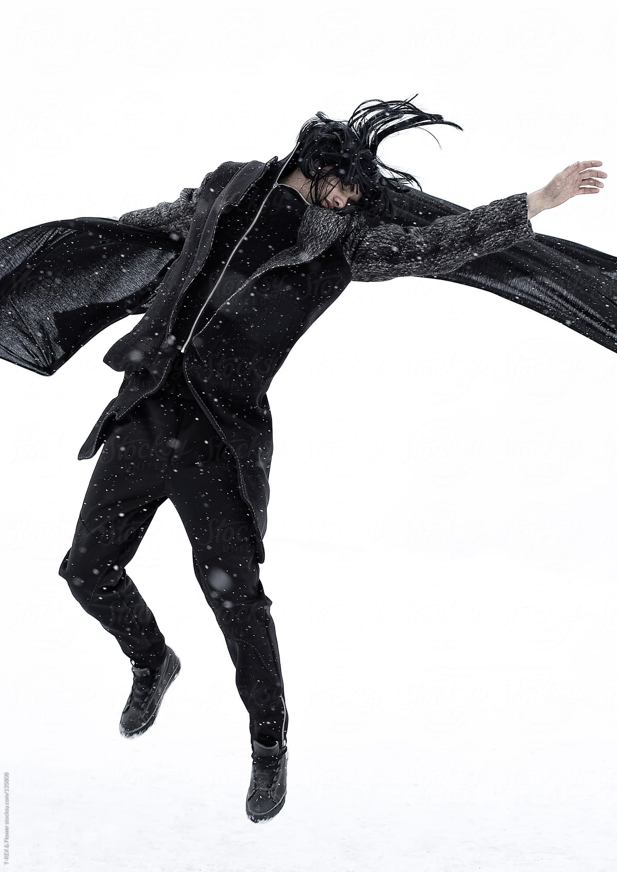 Jumping person with black cape