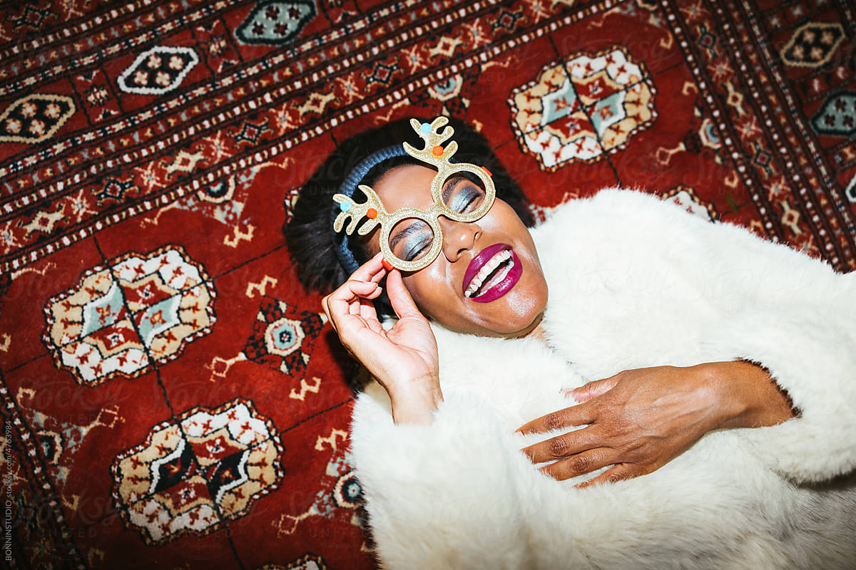 Black woman laughing on retro carpet