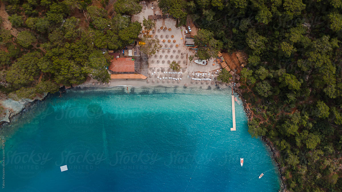 Drone aerial shot of a perfect beach in Turkey lost among woods