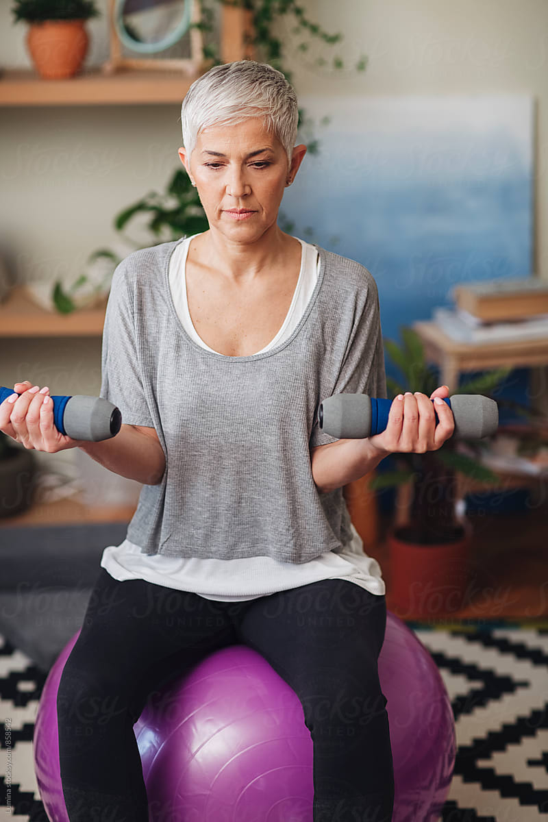 Woman Lifting Weights At Home By Stocksy Contributor Lumina Stocksy woman-lifting-weights-at-home-by-stocksy-contributor-lumina-stocksy