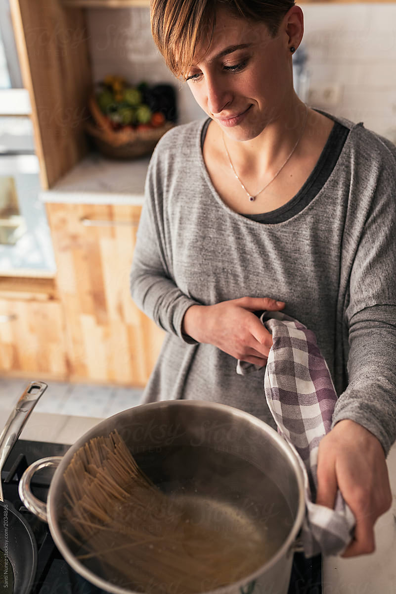 Beautiful Young Woman Cooking In The Kitchen Spaghetti In The Kitchen By Stocksy Contributor 