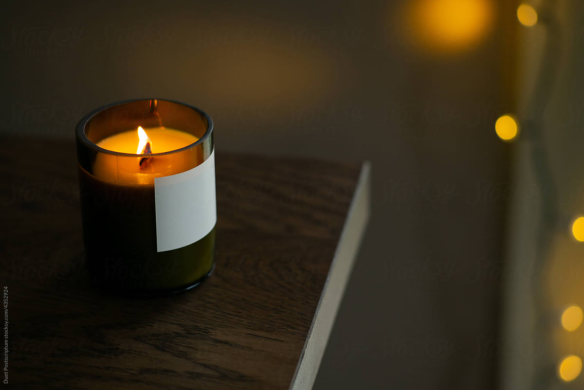 Burning natural candle with a wooden wick