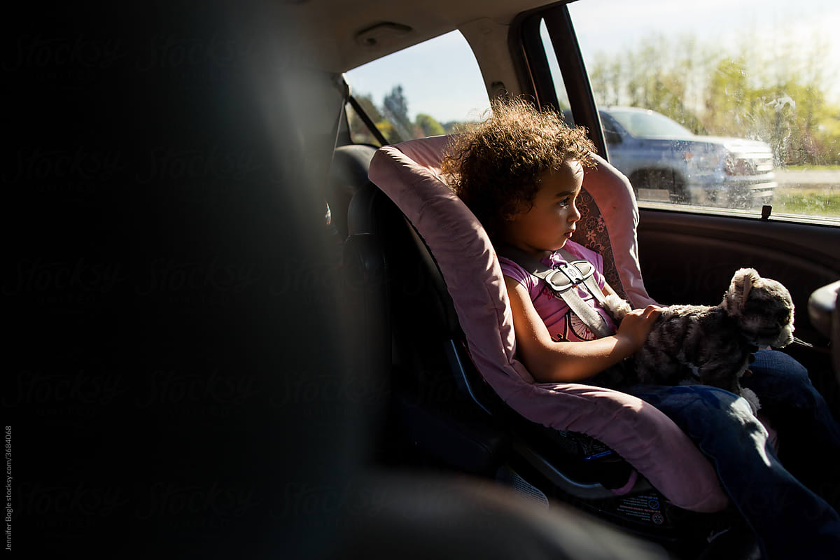Profile of Tired girl in car seat