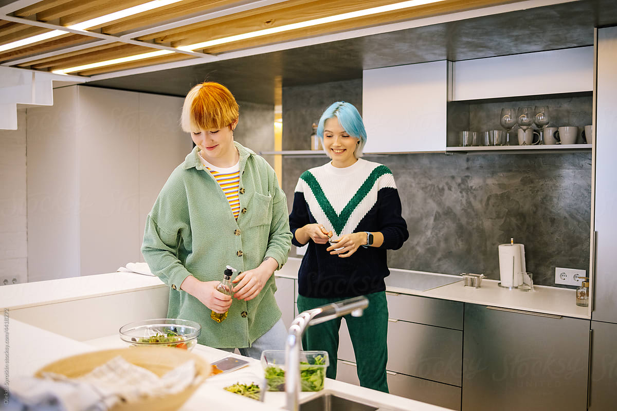 Women cooking healthy breakfast in modern kitchen