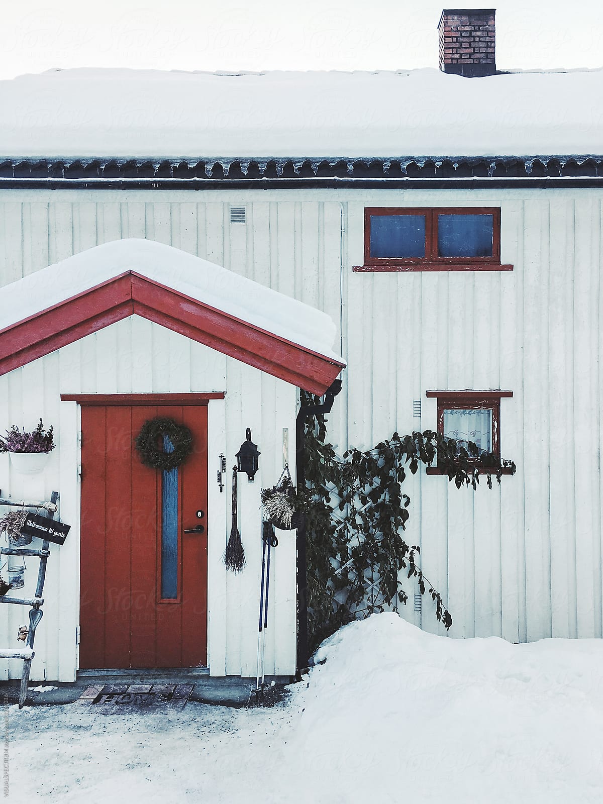 White Christmas - Xmas Decoration on Door of White Wooden Scandinavian Home