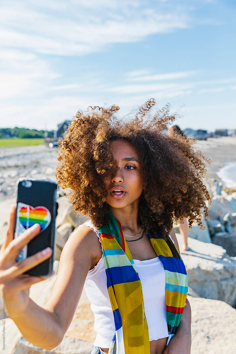 Beautiful African American Girl Taking A Selfie At The Beach By Raymond 