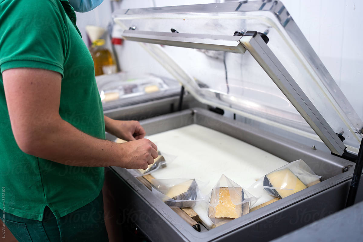 Cheese On A Machine Of Vacuum Packing.