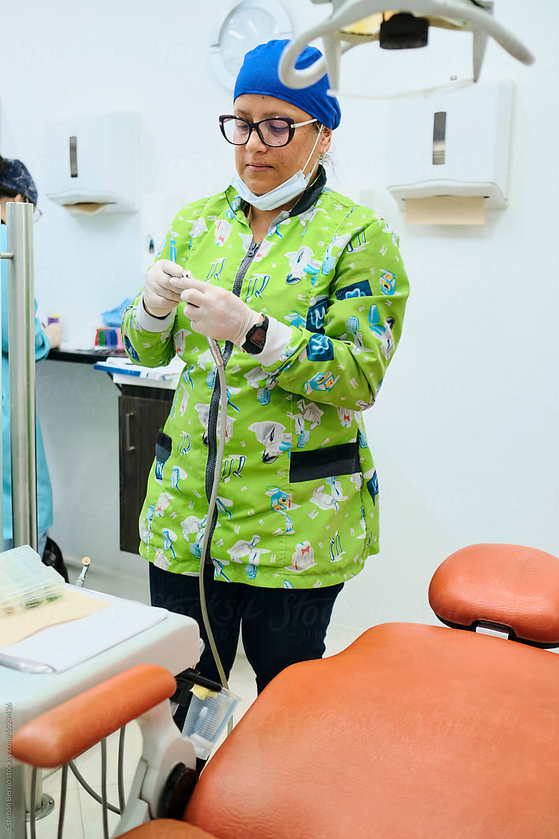 Dentist preparing the equipment