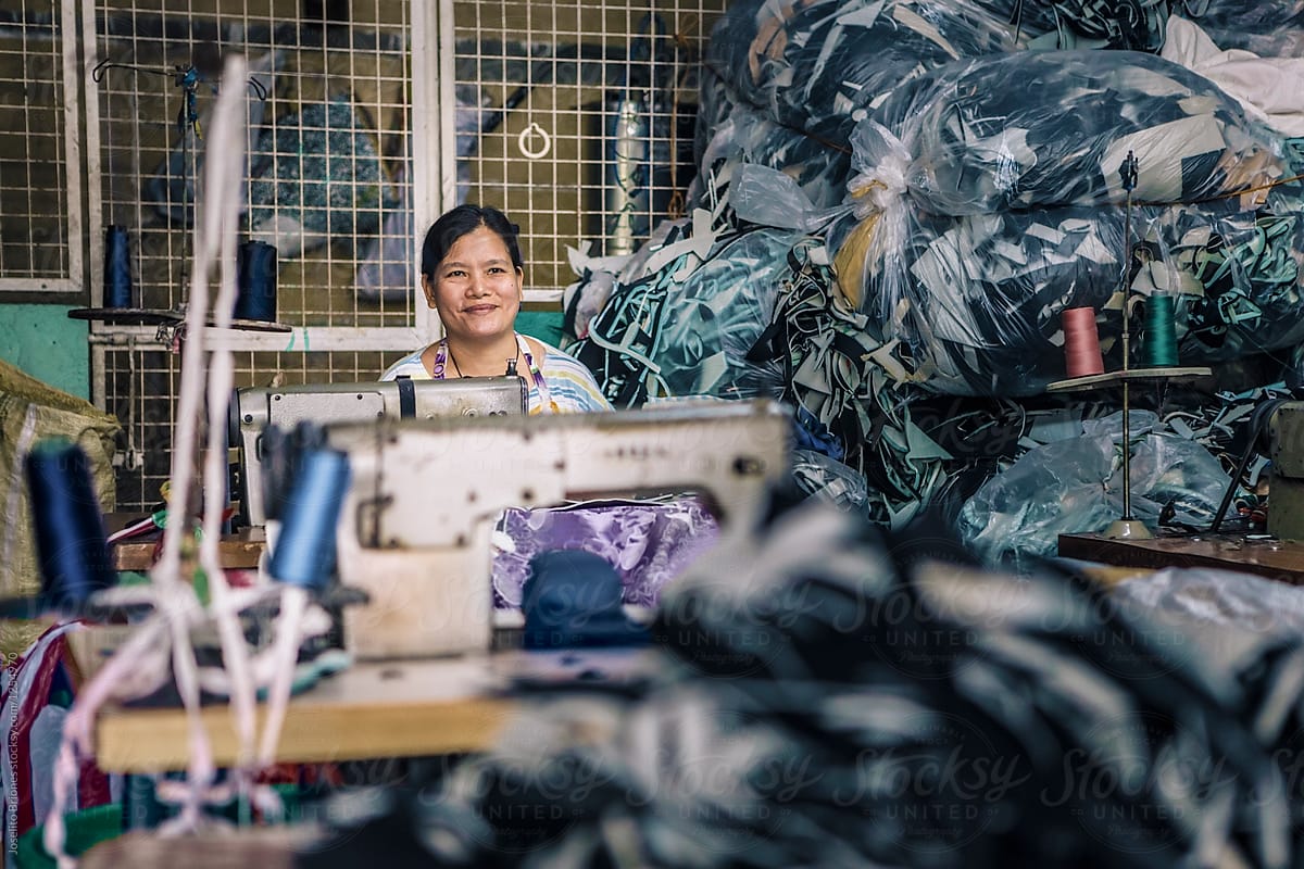 Woman Member of Cooperative Sewing Scraps of Foam in Production of Door Mats