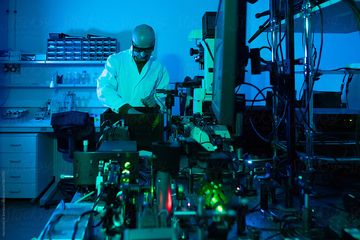 Male Scientist Using Laser Technologies