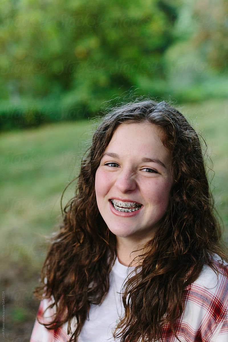 View Portrait Of Beautiful Young Girl With Braces Laughing By Stocksy 8367