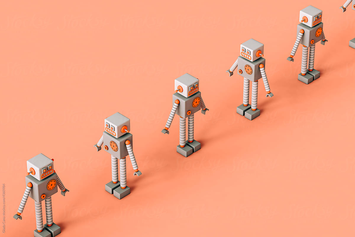 a row of Toy robots on a pink background