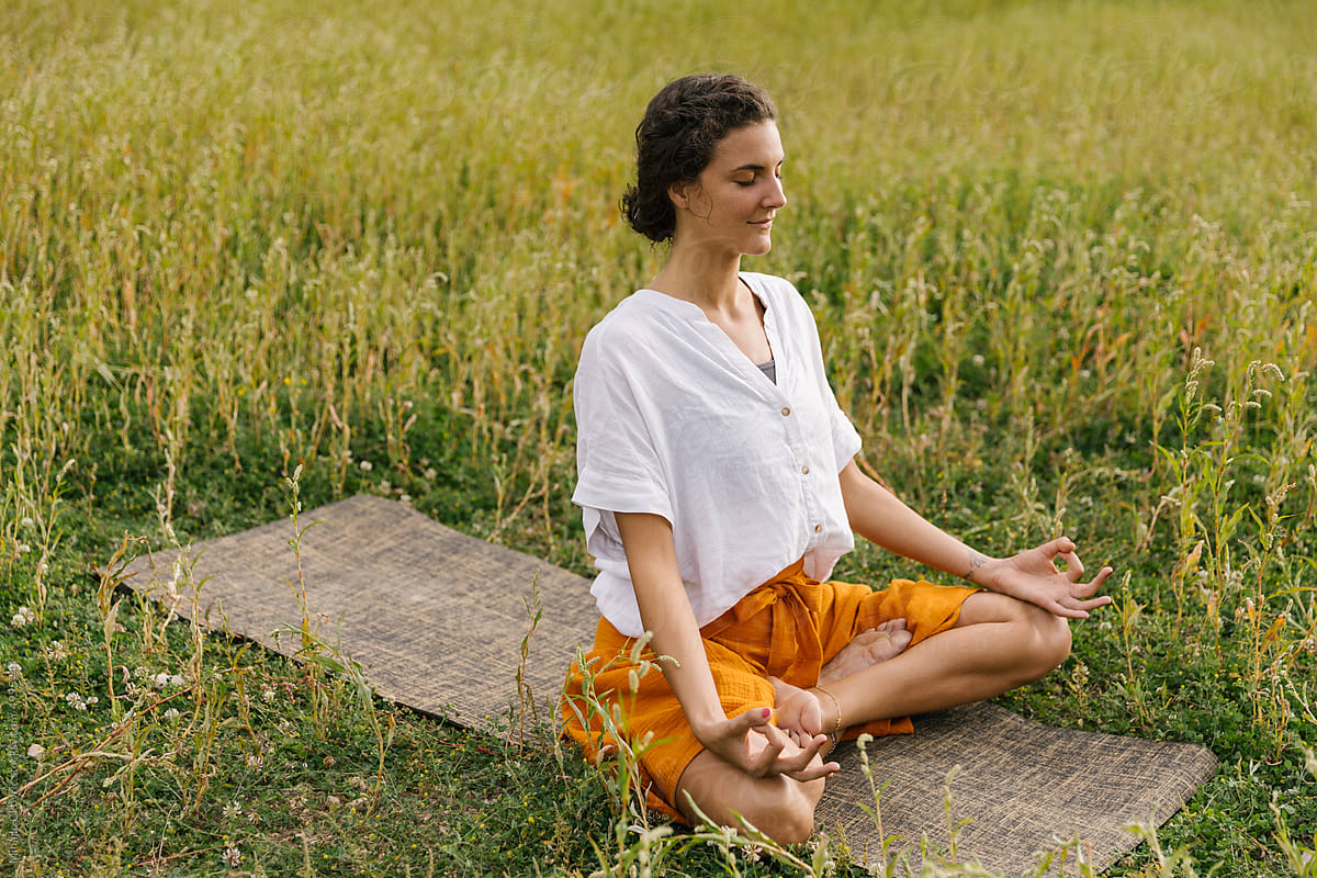 Woman Focused On Meditation, Practising Yoga In Nature