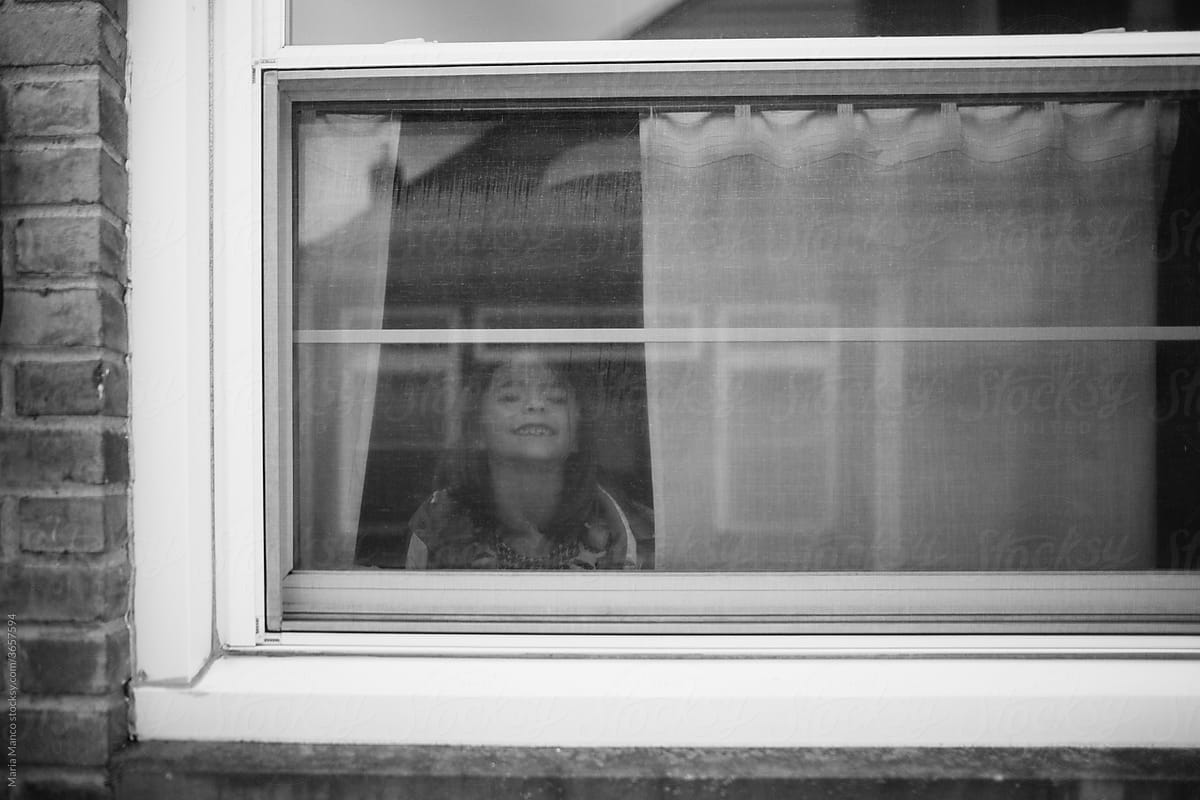 photo of girl through window